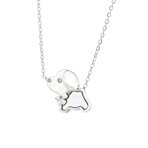 Minimalist silver dog pendant necklace with sparkling diamonds on white background