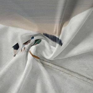 Close-up of bohemian wall tapestry fabric showing soft textures and wild bird art prints