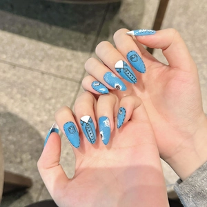 Retro denim style hand-painted press-on nails in long almond shape with blue art design