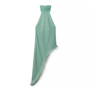 Detail of light green halter top with shimmering fabric and delicate feather trim edge