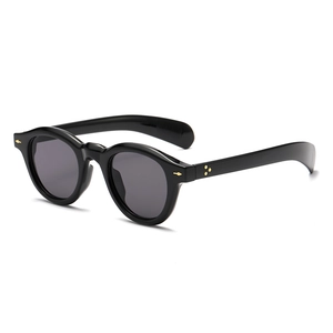 Retro round black sunglasses with gold metal rivets and grey lenses in 45-degree view