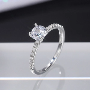 Classic silver engagement ring with round brilliant zircon and pave-set diamond band