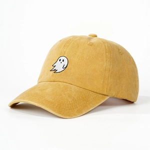 Ginger yellow washed cotton baseball cap with white ghost embroidery in a 45-degree view