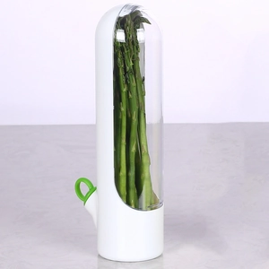Close-up of a white and green plastic asparagus saver herb container for keeping food fresh