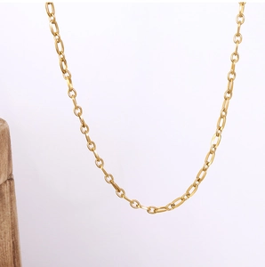 Macro shot of 18k gold plated stainless steel cable chain with polished metal links