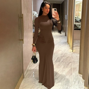Detail of the elegant ruched waist design on this slim-fit brown long sleeve maxi dress