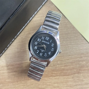 Classic silver elastic band quartz watch with black dial and white numerals on wood