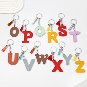 Colorful PU leather alphabet keychains O-Z with matching tassels on a white background