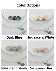 Detailed macro view of four acetate cat hair clips in blue, white, green and pink colors