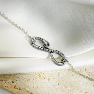Gothic titanium steel snake infinity bracelet with retro silver finish and detailed scales