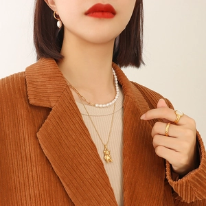 Layered 18K gold plated bear pendant necklace with irregular pearls and matching earrings