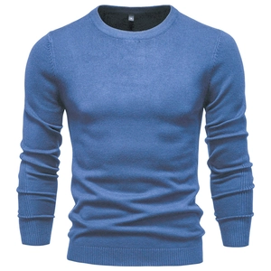 Detailed view of blue crewneck sweater showing fine knit texture and neckline sizing