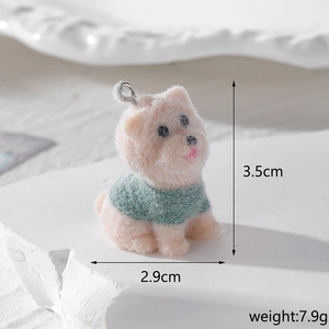 Detail of flocked resin dachshund pendant in green sweater with size and weight info