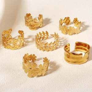 Set of 6 gold metal leaf and flower bangles with adjustable vintage geometric designs