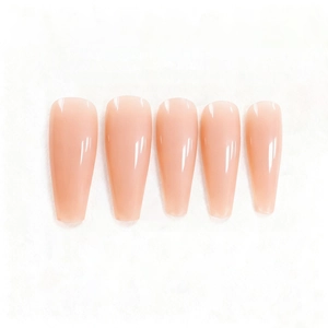 Glossy nude pink jelly press-on nails in long coffin shape displayed on white background