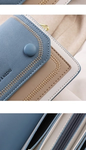 Detail of color-block wallet showing refined wheat-ear stitching and button closure