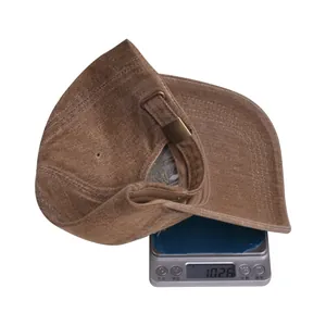 Detailed view of 102.6g lightweight vintage washed baseball cap on an electronic scale