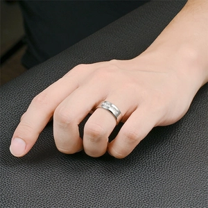 Close-up detail of a modern titanium steel band ring featuring micro-pave cubic zirconia stones