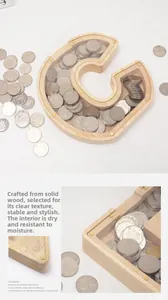 Detail of letter C wooden money box with transparent acrylic cover and metal screws