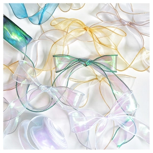 Detail of colorful organza ribbons with wire edges in champagne gold and mint green hues