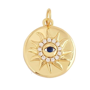 Detail of gold evil eye pendant with blue zircon center and radiant sunburst design