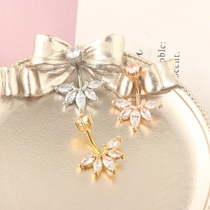 Three-piece belly ring set in silver, gold, and rose gold with marquise zircon stones