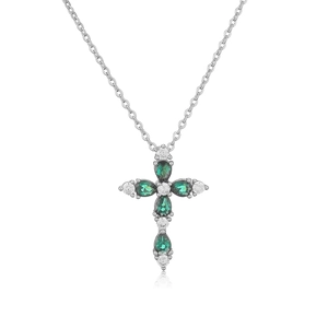 Close-up of cross pendant with pear-cut green stones and white zircons on silver chain