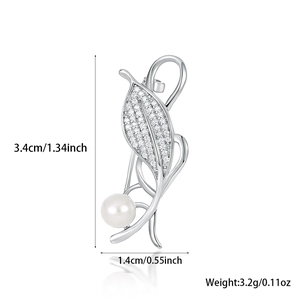 Detailed view of leaf brooch with dimensions 3.4cm by 1.4cm and weight of 3.2g