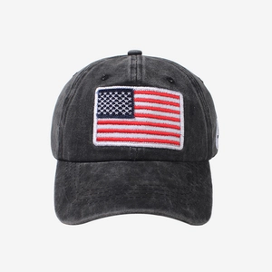 Faded grey cotton baseball cap with American flag embroidery and vintage distressed finish