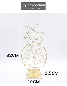 Detailed view of 32cm golden iron hollow pineapple lamp with round solid base