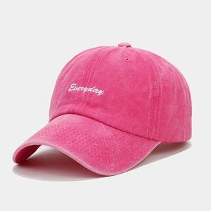 Close-up of rose red washed cotton baseball cap with white Everyday embroidery details