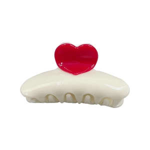 Chic 8.3cm cream hair claw clip with vibrant red heart accent on a sleek white background