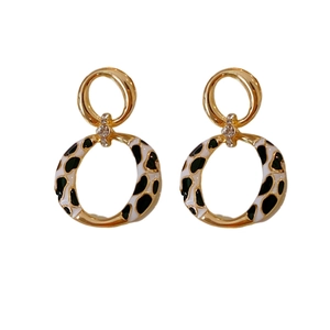 Vintage gold leopard print drop earrings with sparkling rhinestones on white background