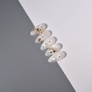 Detail of 5D embossed white butterfly and floral nail art stickers with glitter and rhinestones
