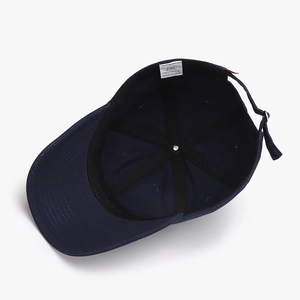 Navy blue cotton baseball cap interior view showing 6-panel structure and sweatband