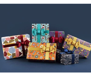 Detail view of colorful cartoon gift boxes with various patterns and satin ribbons