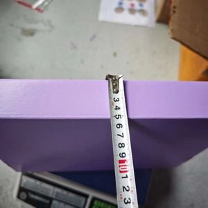 Detail shot showing measurement of a purple DIY craft kit box depth of 11.5cm