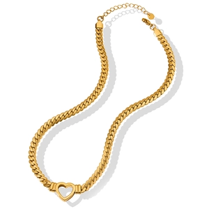 Polished gold Cuban chain necklace with a hollow heart pendant on a white background