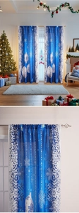 Detail of Christmas window curtain with blue fabric, white snowflakes and hook design