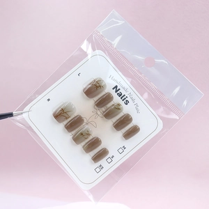 Handmade cat eye press-on nails with orange bamboo gradient patterns in a 10pcs set