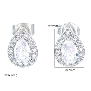 Macro shot of pear-shaped zircon stud earrings showing detailed dimensions of 9x7mm