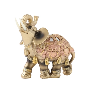 Exquisite golden resin elephant statue with ornate armor details on a white background