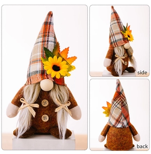 Detailed views of Thanksgiving gnome with sunflower, maple leaf, and plaid hat decorations
