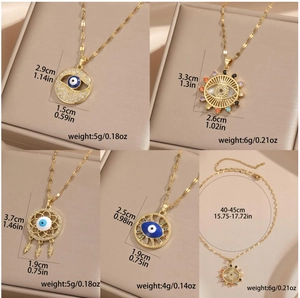 Gold Evil Eye pendant necklaces featuring colorful cubic zirconia on dainty link chains
