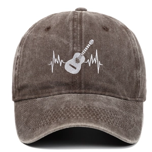 Close-up of guitar heartbeat embroidery on washed cotton baseball cap in coffee brown