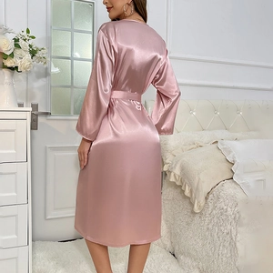 Elegant mauve silk satin robe for women with waist tie and long sleeves in cozy bedroom