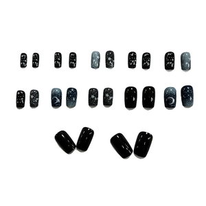 Star and moon press-on nail kit with dark blue gradient design and 24 pieces of glossy nails