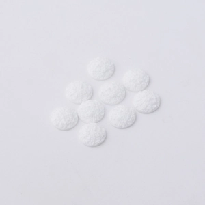 Macro shot of 12mm white druzy resin cabochons with sparkling crystalline texture