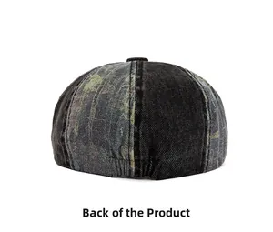 Rear view of washed denim newsboy cap featuring elastic adjustment strap on back