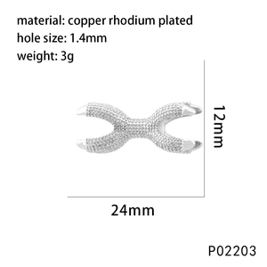 Detail view of crown-shaped coral zircon charm with dimensions 24mm x 12mm and 1.4mm hole size